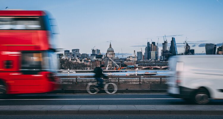 Bus and van sharing the road with a cyclist in London