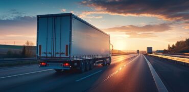 Truck on the road at sunset