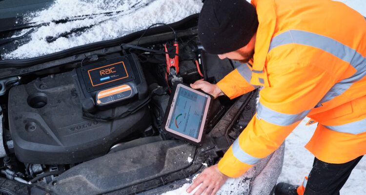 RAC mechanic checking a car battery