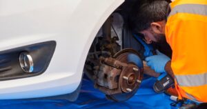 RAC mechanic checking brakes on a car