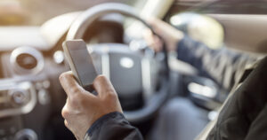 Texting while driving using cell phone in car
