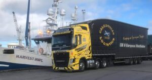 Caledonian Logistics alongside a ship in the harbour