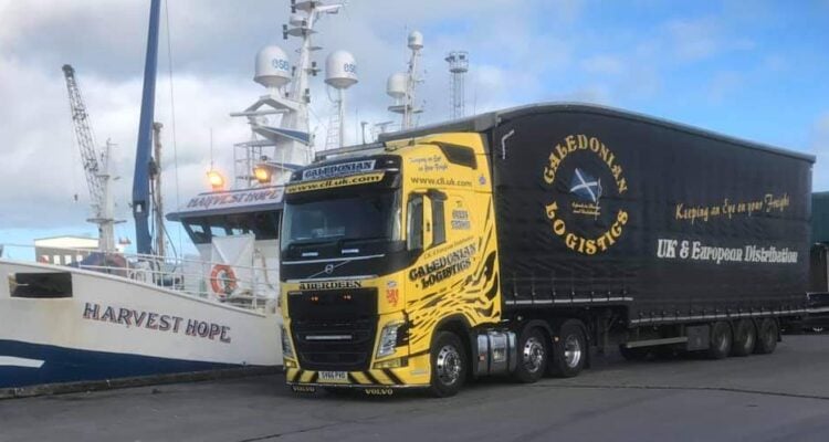 Caledonian Logistics alongside a ship in the harbour