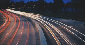 Timelapse image of a busy motorway and the economic value of freight