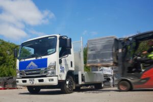 Mac roofing celebrates 50 years with new isuzu truck